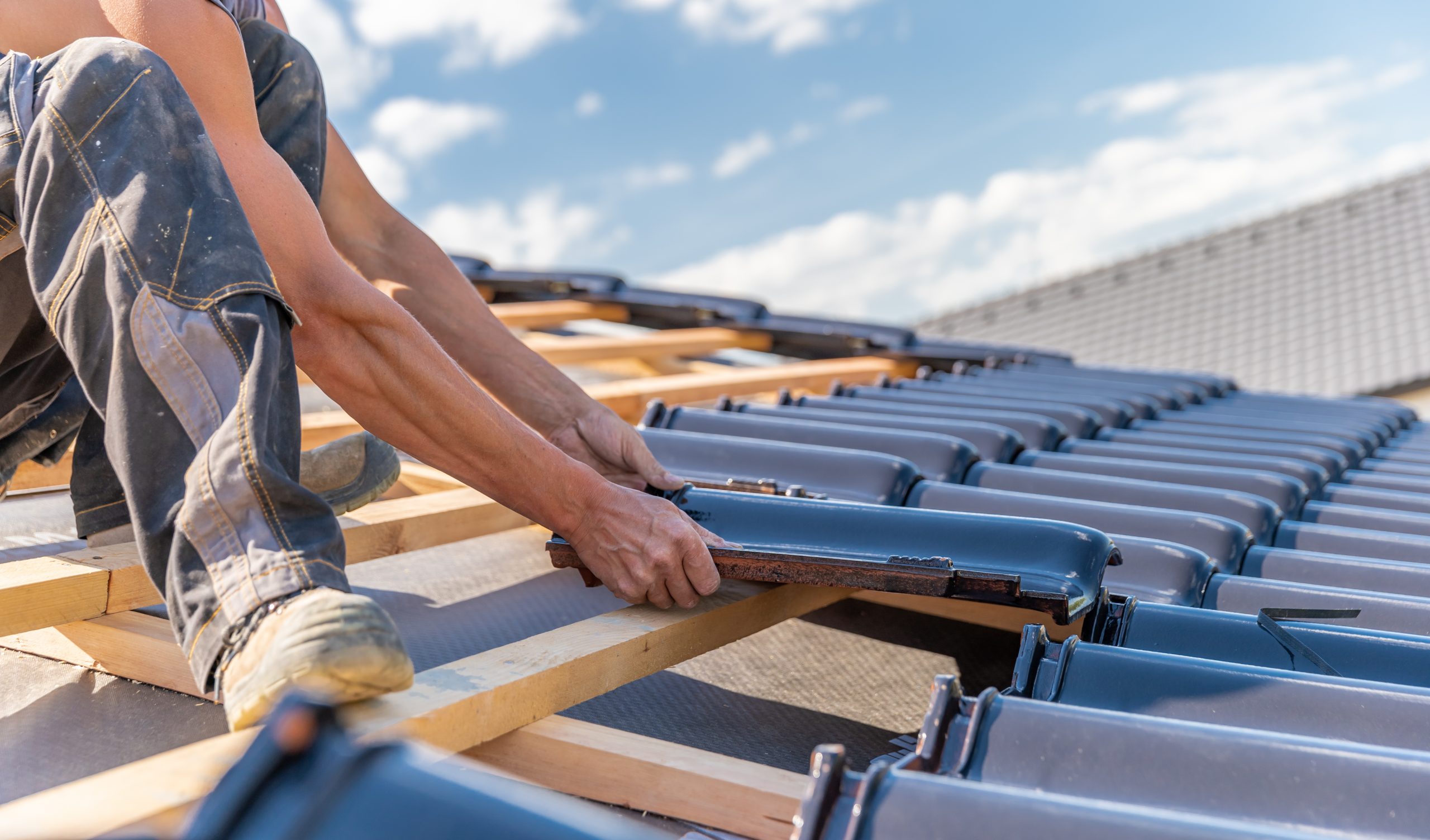 manufacture of the roof of a family house from ceramic tiles.